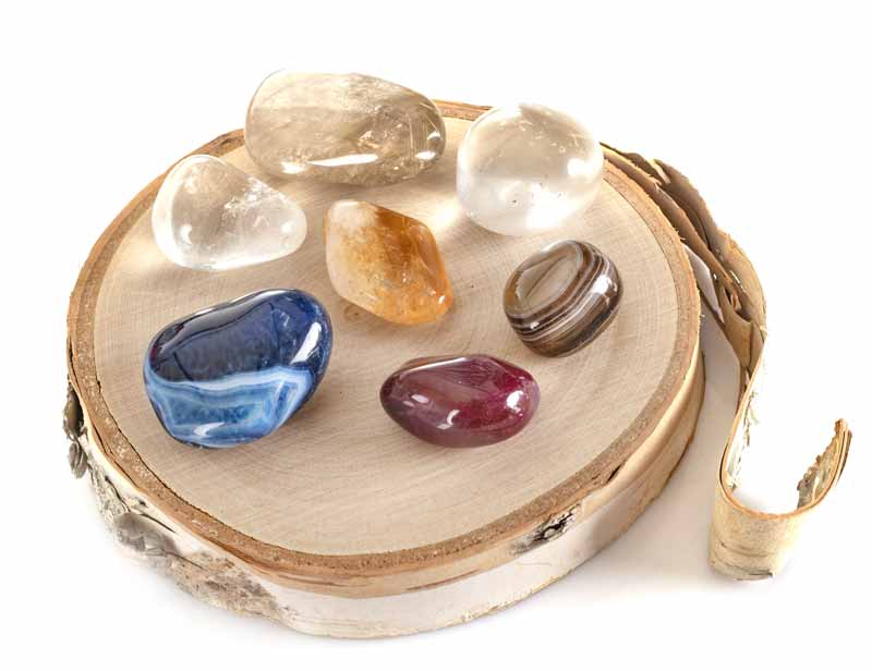 polished stones on wood round