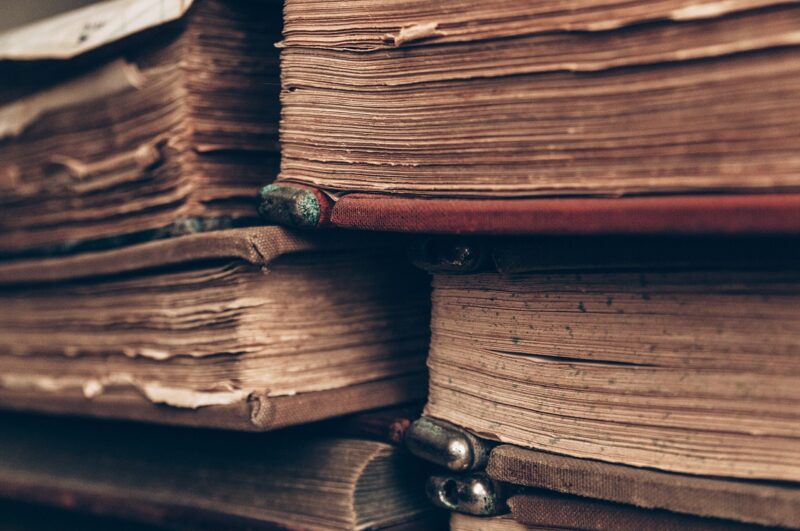 stack of books for paper research