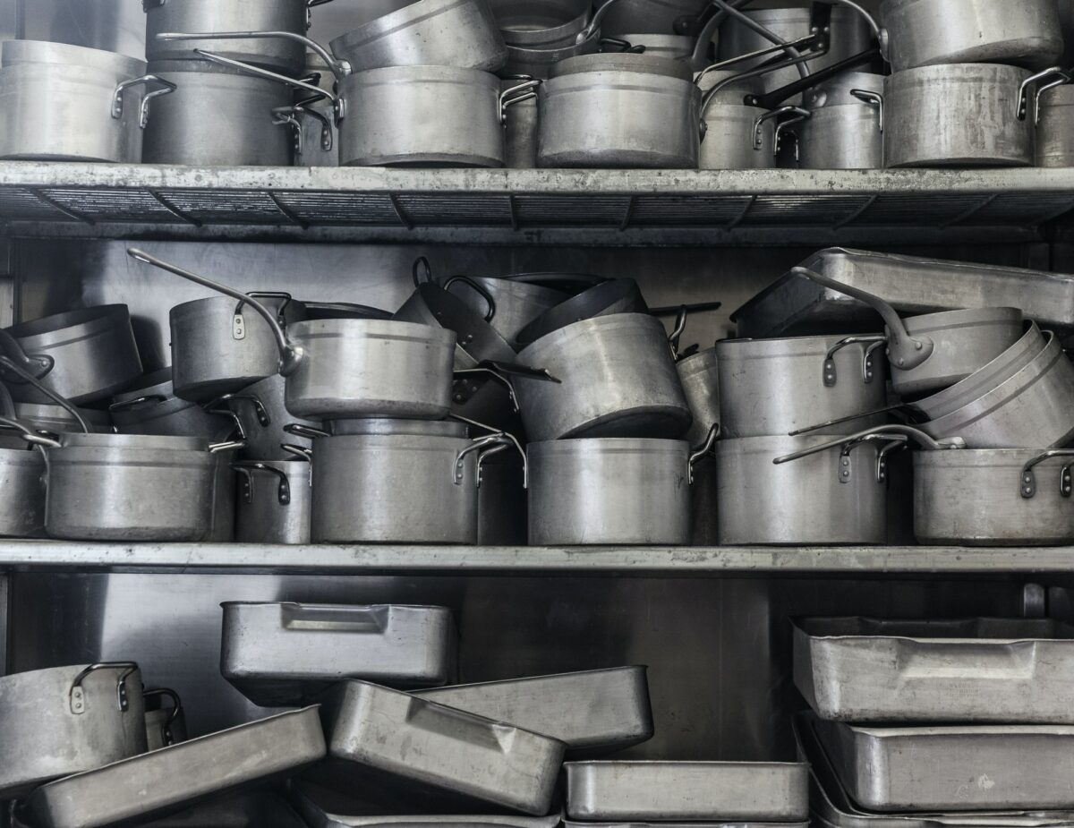 Shelf full of pans all in chrome