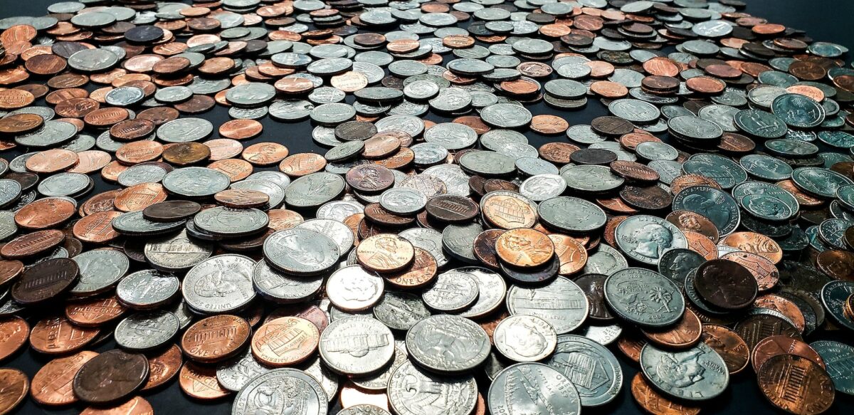 Denominations of various coins in collection of pocket change in business and finance.