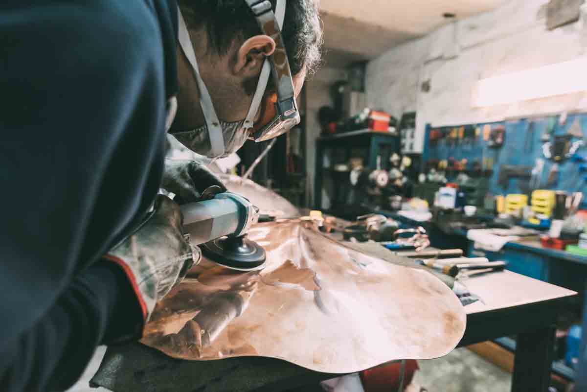 Metalworker Polishing Copper